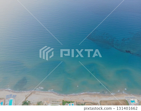 Aerial drone view of sea, beach and wave patterns on water. 131401662