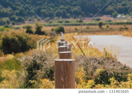 Authentic fence in Crete mountains made of cylindrical wooden bars. 131401685