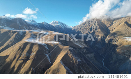 Breathtaking Georgian Mountains with Snowy Peaks under the Sun 131401691