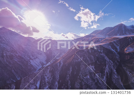 Breathtaking Georgian Mountains with Snowy Peaks under the Sun 131401736