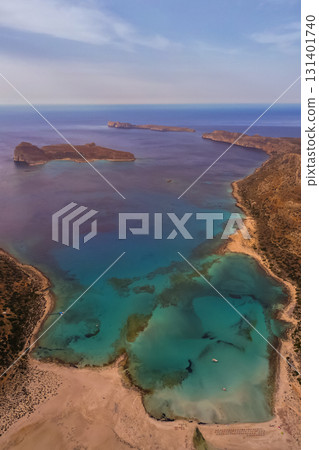 Balos Bay beach in Crete with white sand and inviting crystal-clear sea, attracting tourists Balos Bay beach in Crete with white sand and inviting crystal-clear sea, attracting tourists 131401740