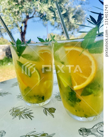 Refreshing Orange Mojito by the Pool 131401745