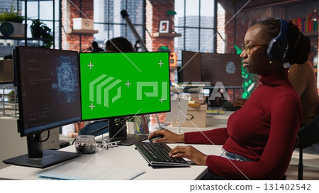 Isolated screen PC in workspace used by AI researcher working with artificial intelligence technology. Mockup computer monitor used by employee developing AI systems in tech startup, camera A 131402542