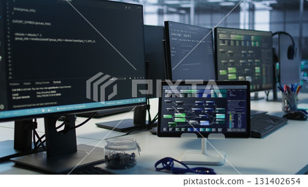 PCs, headphones and tablets in data center employing machine learning technology to maintain company network infrastructure. Electronic devices used in server room to ensure optimal system performance 131402654