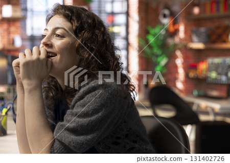 Happy ecstatic trader examines financial documentation on her PC, analyzing stock market movements and business trends. Woman investor feeling satisfied with cryptocurrency, financial gain. Happy ecstatic trader examines financial documentation on her PC, analyzing stock market movements and business trends. Woman investor feeling satisfied with cryptocurrency, financial gain. 131402726