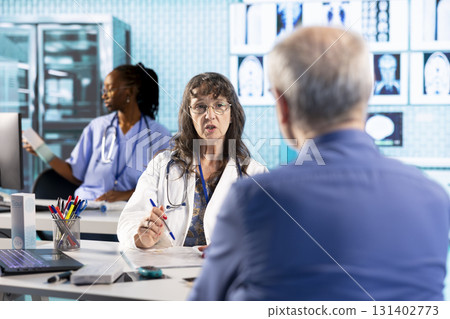 Senior woman physician and patient engage in a medical examination with diagnostic tools to provide the right diagnostic report. Medic showcasing healthcare practices on insurance. 131402773