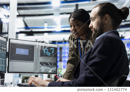 Multiethnic team of engineering specialists working together for solar power manufacturing process, strengthening infrastructure and business development. Renewable energy in a plant. 131402774