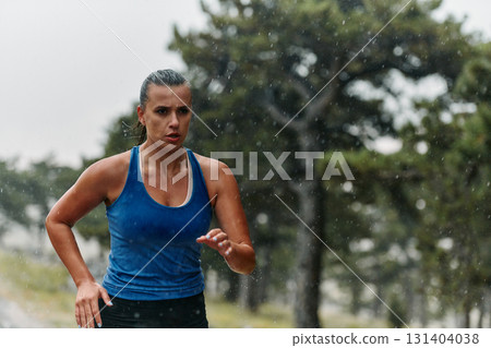 Unstoppable: A Determined Athlete Trains Through the Rain in Pursuit of Marathon Glory Unstoppable: A Determined Athlete Trains Through the Rain in Pursuit of Marathon Glory 131404038