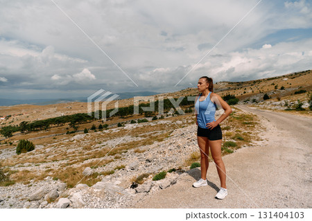 Determined Woman Athlete Preparing for Morning Run 131404103