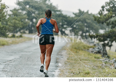 Unstoppable: A Determined Athlete Trains Through the Rain in Pursuit of Marathon Glory Unstoppable: A Determined Athlete Trains Through the Rain in Pursuit of Marathon Glory 131404166