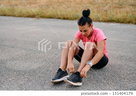 Athletic Woman Preparing for Morning Run 131404179