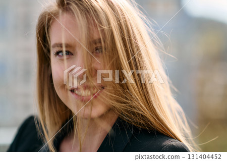 Portrait of a Stylish Business Blonde Posing on Terrace in Urban Cityscape. Portrait of a Stylish Business Blonde Posing on Terrace in Urban Cityscape. 131404452