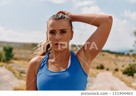Determined Woman Athlete Preparing for Morning Run 131404463