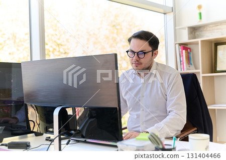 Company Director in a Modern Office, Focused on Work at Computer Company Director in a Modern Office, Focused on Work at Computer 131404466