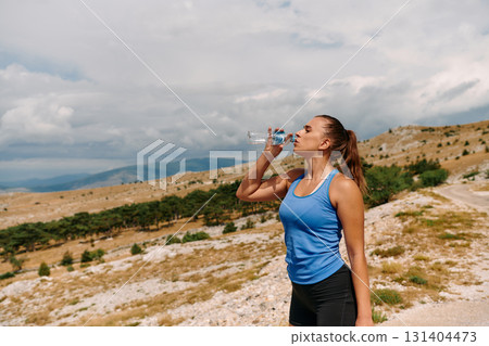 Couple running in nature at morning wearing protective face masks 131404473