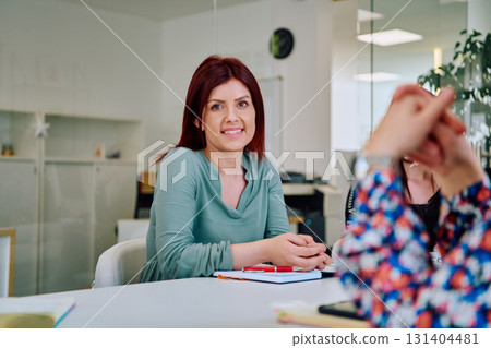 Professional Businesswomen Leading Meeting on New Projects in Modern Office. 131404481