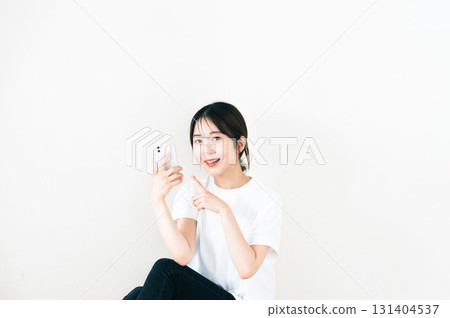 A woman using a smartphone 131404537
