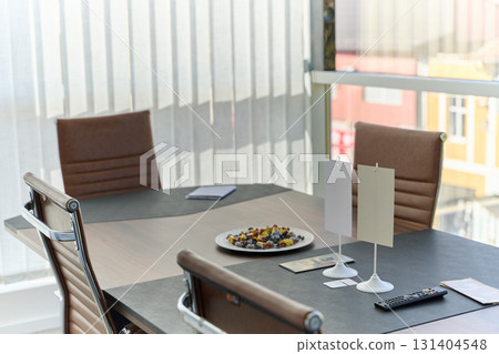 Modern Office Interior with Wooden Furniture, Conference Table, and Computers Modern Office Interior with Wooden Furniture, Conference Table, and Computers 131404548