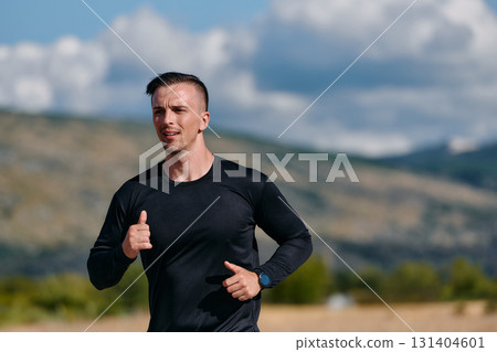 Athletic Man Jogging in the Sun, Preparing His Body for Life's Extreme Challenges 131404601