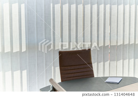 Modern Office Interior with Wooden Furniture, Conference Table, and Computers 131404648
