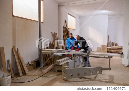 Close Up of Worker Carefully Cutting and Planing Wooden Pieces for Furniture in Wood Industry Close Up of Worker Carefully Cutting and Planing Wooden Pieces for Furniture in Wood Industry 131404671