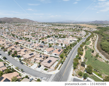 Aerial view of a sprawling neighborhood of family homes in Menifee, California, USA. Aerial view of a sprawling neighborhood of family homes in Menifee, California, USA. 131405005