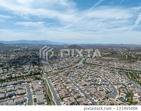 Aerial view of a sprawling neighborhood of family homes in Menifee, California, USA. Aerial view of a sprawling neighborhood of family homes in Menifee, California, USA. 131405006