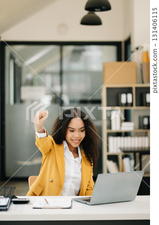 business woman are delighted and happy with the work they do on their tablet, laptop 131406115