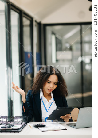 Confident business expert attractive smiling young woman holding digital tablet 131406132