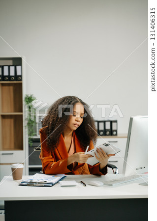 Overworked young Asian businesswoman office worker suffering from neck pain after had a long day office syndrome concept 131406315