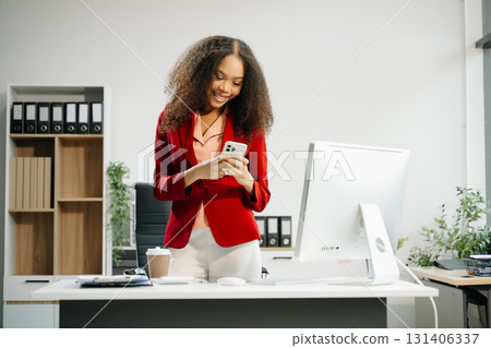 Confident business expert attractive smiling young woman holding digital tablet on desk in creative office. Confident business expert attractive smiling young woman holding digital tablet on desk in creative office. 131406337