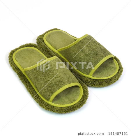 Green terry cloth open toe slippers with fuzzy microfiber soles and soft trim isolated on white background 131407161