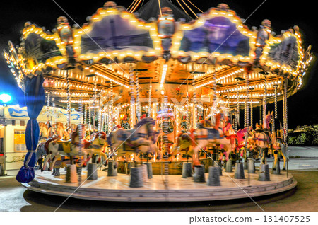 Illuminated merry-go-round at night (Paris, France) Illuminated merry-go-round at night (Paris, France) 131407525