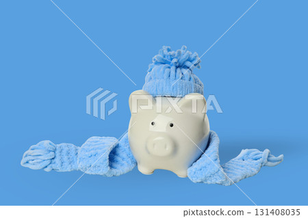 Piggy bank in scarf and hat shows winter savings 131408035
