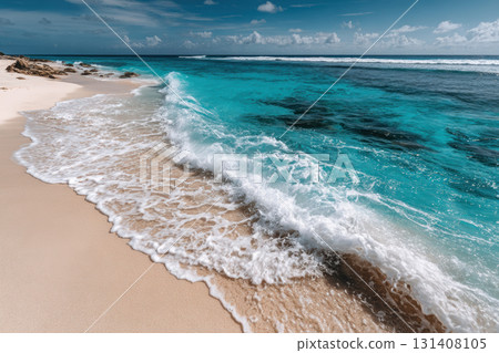 Turquoise ocean waves gently touch white sandy beach 131408105