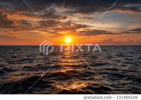 Golden sunset illuminating calm ocean waves at horizon Golden sunset illuminating calm ocean waves at horizon 131408106