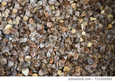 Close up of a pile of buckwheat grains, a healthy and nutritious food source. 131408882