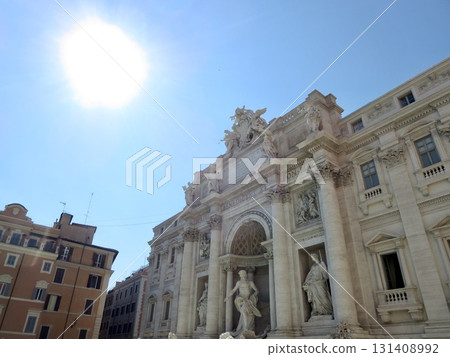 Shining sun and stone statues of mythical sea gods floating on the palace walls. Design, decoration, advertising, poster material. Shining sun and stone statues of mythical sea gods floating on the palace walls. Design, decoration, advertising, poster material. 131408992