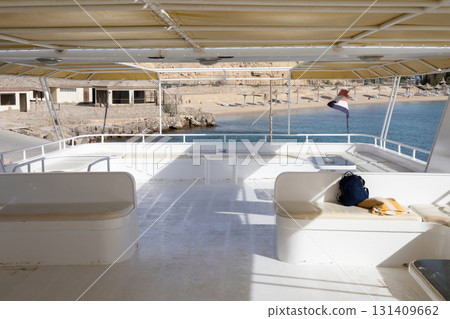 Tranquil coastal scene on boat deck by the beach 131409662
