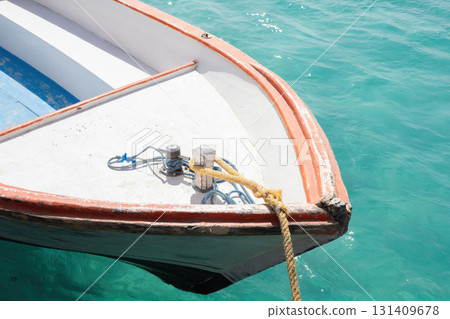 Peaceful day on a turquoise sea with a moored boat in tropical waters 131409678