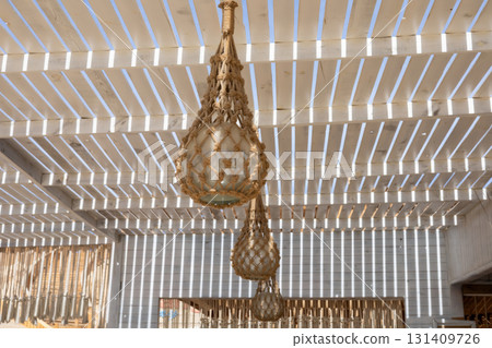 Rustic lanterns in bohemian outdoor pergola with natural light Rustic lanterns in bohemian outdoor pergola with natural light 131409726