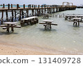 Seaside pier and tables on a sunny day at the beach 131409728