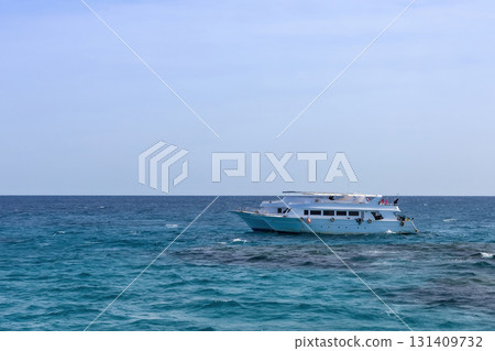 Tranquil ocean scene with sailboat in open sea as summer vacation inspiration Tranquil ocean scene with sailboat in open sea as summer vacation inspiration 131409732