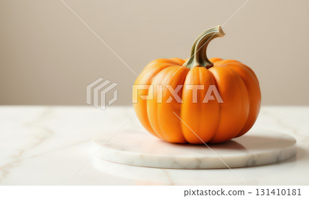 Small orange pumpkin on marble surface Small orange pumpkin on marble surface 131410181