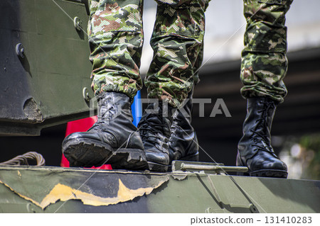 Soldiers on top of Colombian army tank, Military troops riding armored vehicle, Armed forces on battle tank Soldiers on top of Colombian army tank, Military troops riding armored vehicle, Armed forces on battle tank 131410283