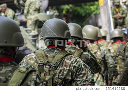 Colombian armed forces with armored units and tanks, Army organizing before combat, Soldiers preparing for military mission 131410288