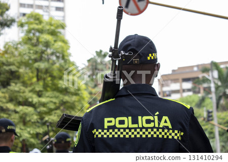Colombian police officer with rifle, Armed law enforcement in Colombia, Police officer carrying firearm Colombian police officer with rifle, Armed law enforcement in Colombia, Police officer carrying firearm 131410294