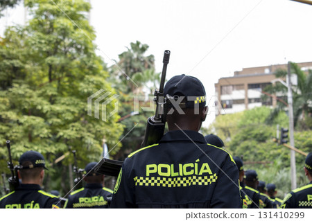Armed police with long range weapons, Law enforcement officers carrying rifles, Colombian police with heavy firearms Armed police with long range weapons, Law enforcement officers carrying rifles, Colombian police with heavy firearms 131410299