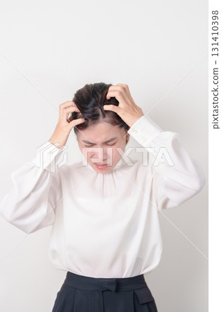 Business woman having itchy Scalp and Head hair, Dandruff, Dry Scalp, Skin Allergy Seborrheic dermatitis. Dermatology, Leprosy day, Systemic lupus erythematosus, SLE, Psoriasis and Atopic Eczema rash Business woman having itchy Scalp and Head hair, Dandruff, Dry Scalp, Skin Allergy Seborrheic dermatitis. Dermatology, Leprosy day, Systemic lupus erythematosus, SLE, Psoriasis and Atopic Eczema rash 131410398