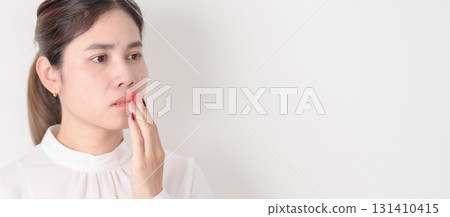 Business woman having Mouth ache for concepts of Mouth Ulcer Sore, Aphthous Stomatitis, Oral Lesions, Halitosis, Oral Health Care, Toothache and Gum Disease, Dental Caries, Gingivitis and Periodontal Business woman having Mouth ache for concepts of Mouth Ulcer Sore, Aphthous Stomatitis, Oral Lesions, Halitosis, Oral Health Care, Toothache and Gum Disease, Dental Caries, Gingivitis and Periodontal 131410415